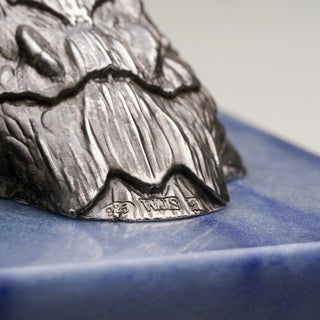 Patinated sterling silver crocodile sculpture with gold and black ruthenium plating, sapphire eyes and a Willy Wagtail with diamond eyes, mounted on a blue aventurine stone base.
