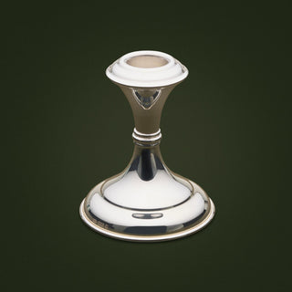 Contemporary, medium candlestick featuring stylish polish. To accommodate one candle only. 21cm tall. 