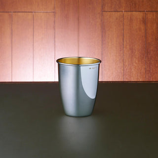 Australian Sterling Silver classic curved beaker with rolled lip. Featuring a polished exterior and matte gold-plated interior. 9cm tall and accommodating for a volume of 240mL.