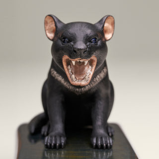 Sterling silver Tasmanian Devil sculpture on a blue tiger’s eye stone base.