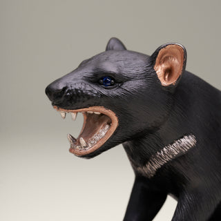 Sterling silver Tasmanian Devil sculpture on a blue tiger’s eye stone base.