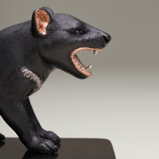 Sterling silver Tasmanian Devil sculpture on a blue tiger’s eye stone base.