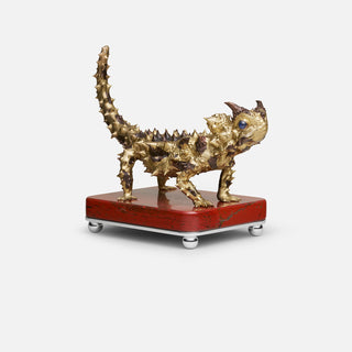 Sterling silver Thorny Devil sculpture with yellow gold plating, copper detailing and sapphire eyes, mounted on a red jasper stone base.