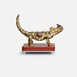 Sterling silver Thorny Devil sculpture with yellow gold plating, copper detailing and sapphire eyes, mounted on a red jasper stone base.