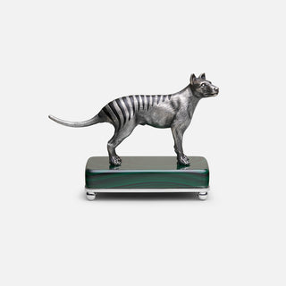Sterling silver Thylacine sculpture with black enamel stripes and diamond accents, mounted on a malachite stone base.